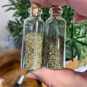 Mini glass bottles with olivine sand green sand crystals